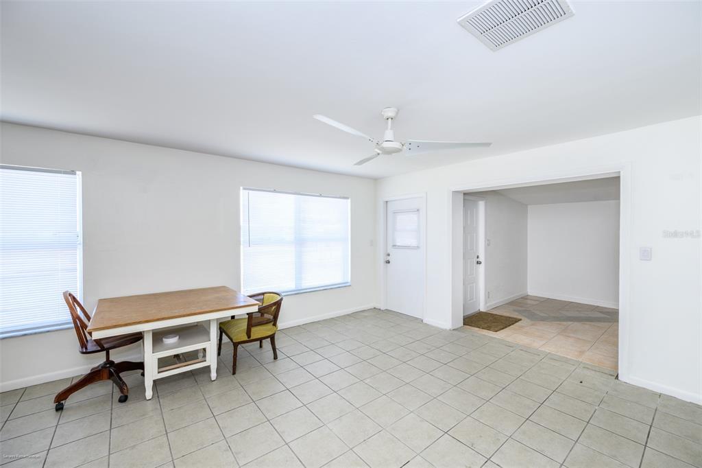 A dining area with tile flooring, a ceiling fan, and a wooden table with chairs — 510 SHARON CIRCLE, PORT CHARLOTTE, FL