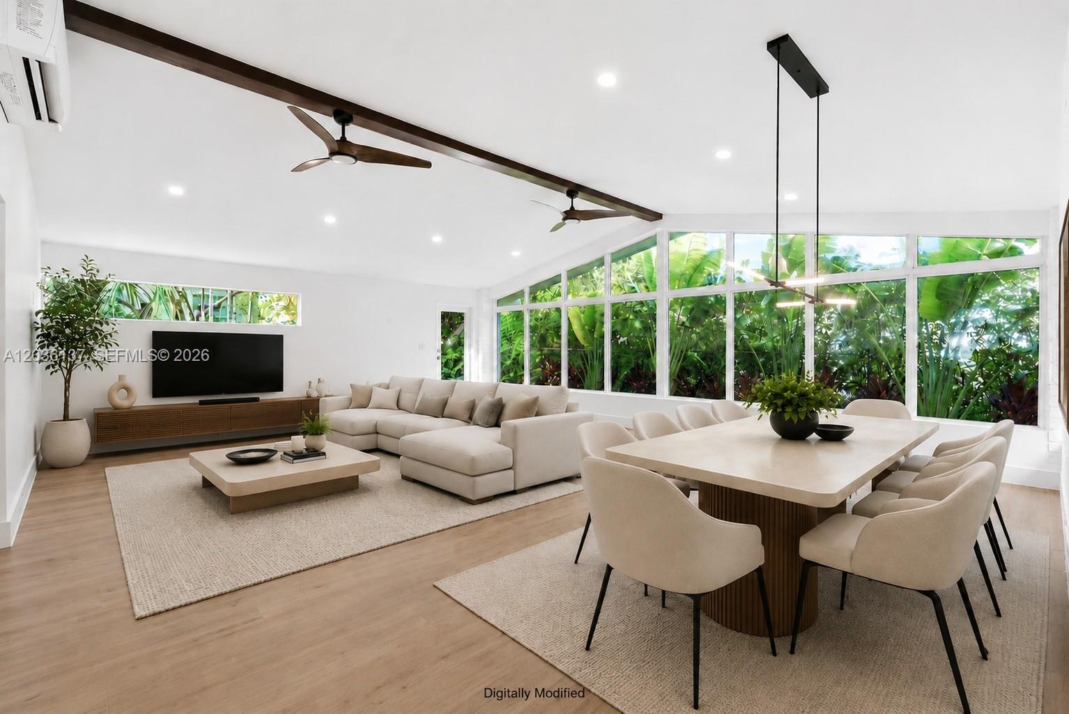 This open-concept living and dining room features vaulted ceilings, exposed beams, and floor-to-ceiling windows — 1451 Urbino Ave, Coral Gables FL 33146, CORAL GABLES, FL