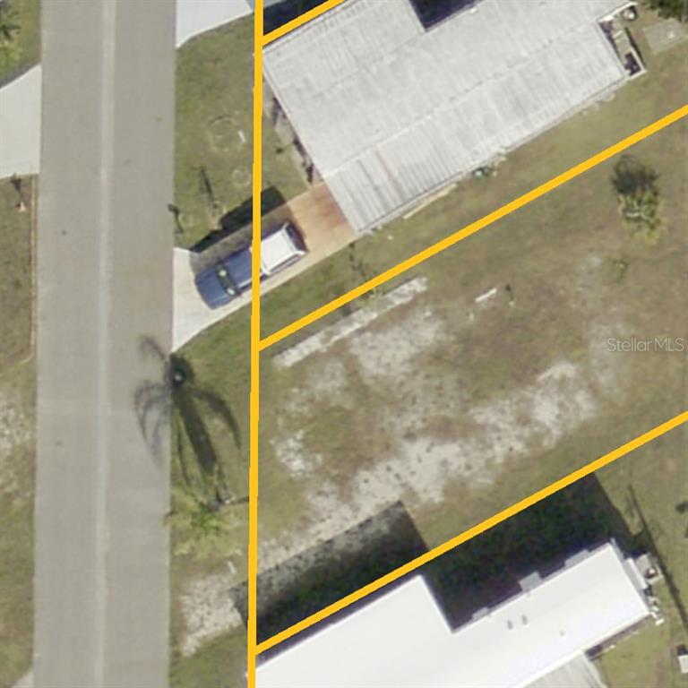 This is an aerial view of a vacant residential lot outlined in yellow — 217 WOLVERINE AVENUE, NORTH PORT, FL