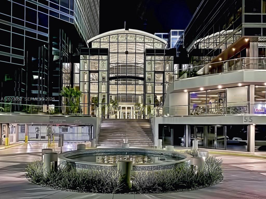 An exterior view of a modern building entrance with a fountain and grand staircase — 515 N Flagler Dr, West Palm Beach FL 33401, WEST PALM BEACH, FL