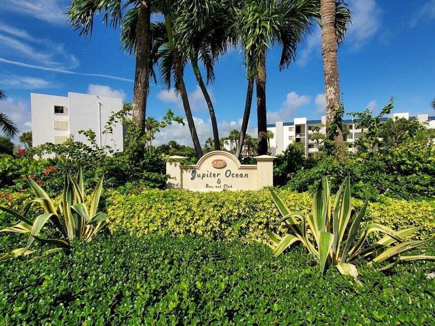 A sign for Jupiter Ocean Racquet Club stands in front of palm trees and apartment buildings — 1605 S Us Highway 1 # F203, Jupiter FL 33477, JUPITER, FL