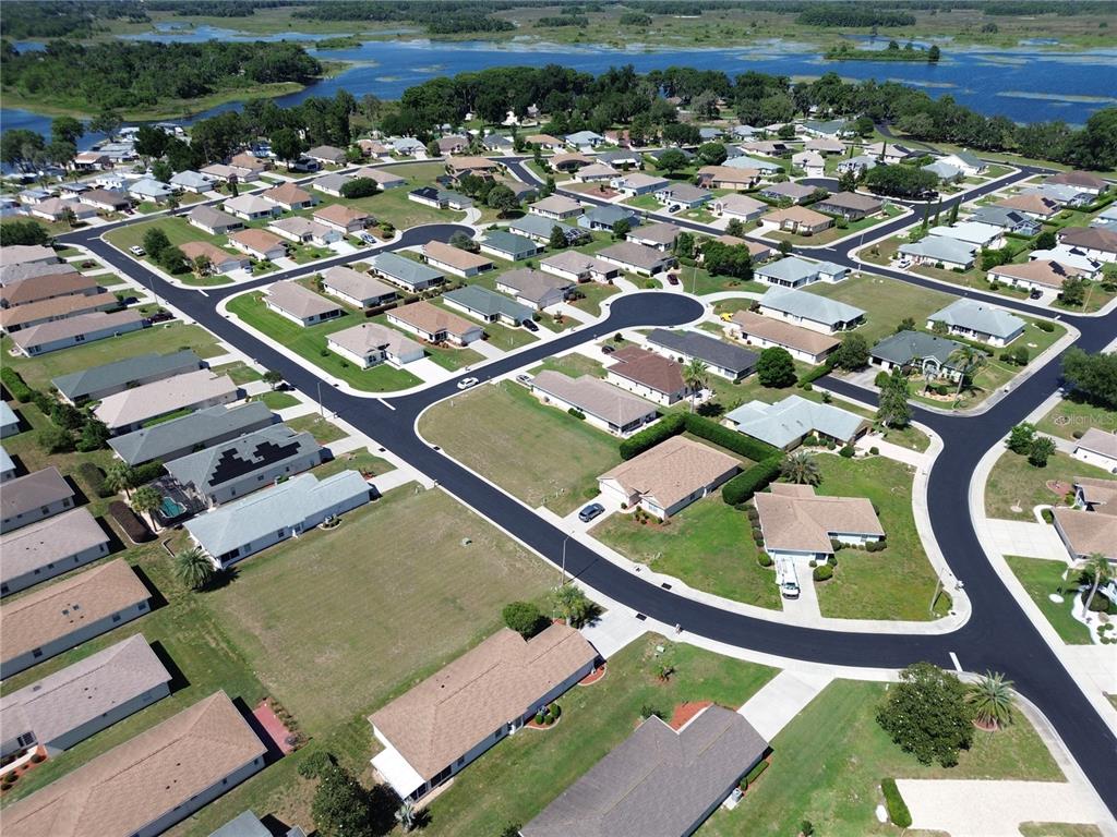 An aerial view shows a residential neighborhood with single-family homes and paved streets — 3756 E KIWI COVE COURT, HERNANDO, FL