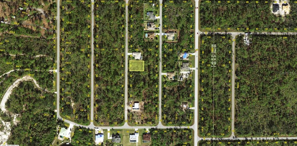 This is an aerial map view of a residential neighborhood with a highlighted vacant lot — 1274 HESTER STREET, PORT CHARLOTTE, FL