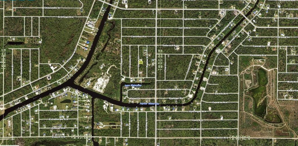 This is an aerial map showing a residential lot highlighted in yellow within a neighborhood — 1274 HESTER STREET, PORT CHARLOTTE, FL