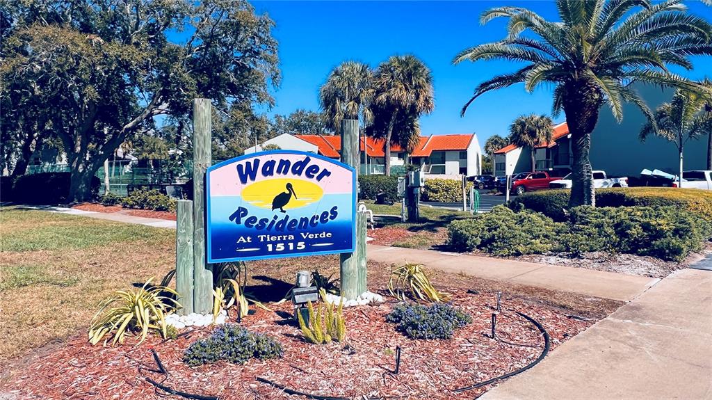 A sign for Wander Residences at Tierra Verde stands in a landscaped area with palm trees — 1515 PINELLAS BAYWAY S UNIT 46, ST PETERSBURG, FL