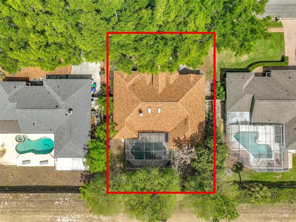 An aerial view shows a house with a screened pool and a red property boundary — 9144 GALLEON COURT, ORLANDO, FL