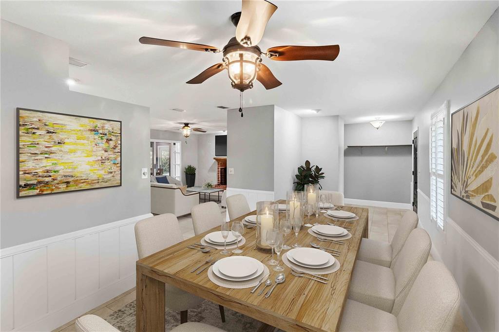 A dining room with a wooden table, upholstered chairs, and a ceiling fan — 5304 ROSECREST CIRCLE, TAMPA, FL