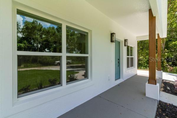 A room with light-colored walls, a ceiling fan, and wood-look tile flooring — TBD Lot 18 APAWAMIS DRIVE, SORRENTO, FL