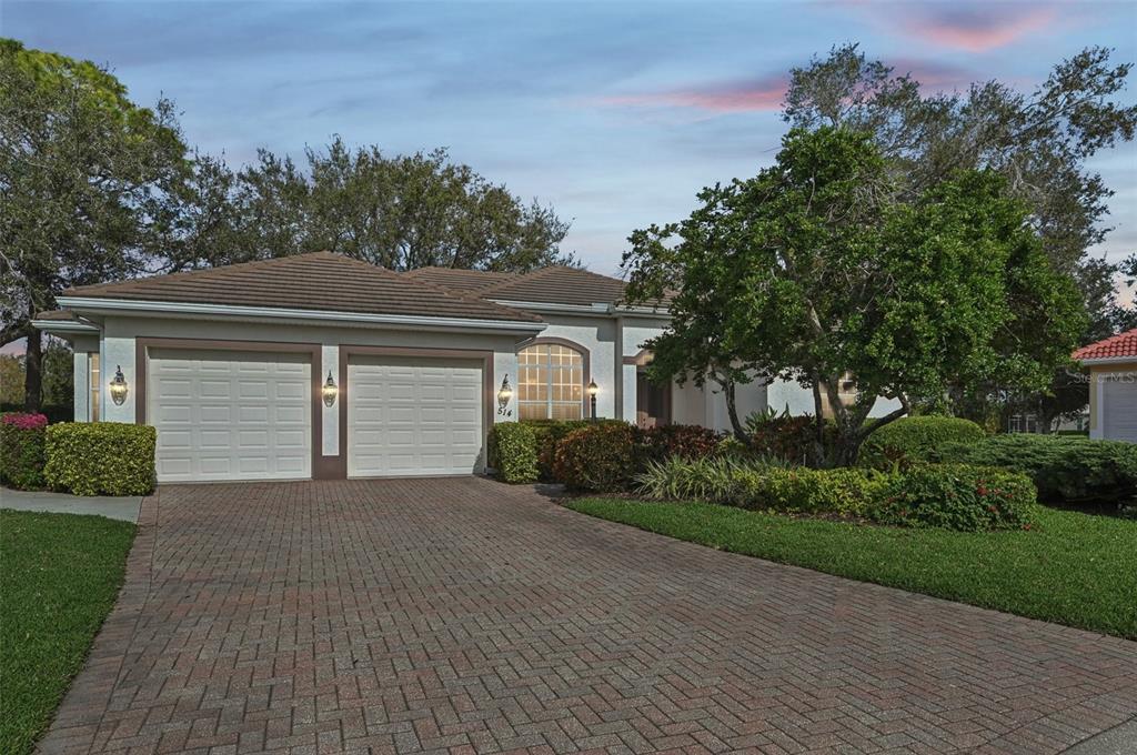 A single-story house with a two-car garage and a brick paver driveway — 514 SUMMERFIELD WAY, VENICE, FL