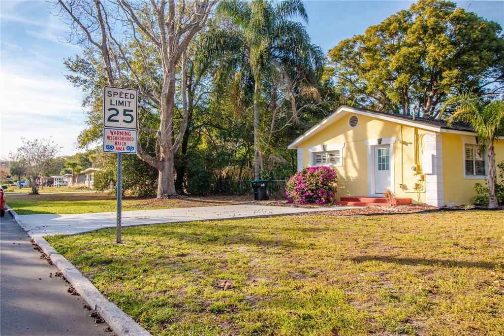 A yellow house with a white door sits behind a speed limit sign and trees — 3120 PEEL AVENUE UNIT 3, ORLANDO, FL