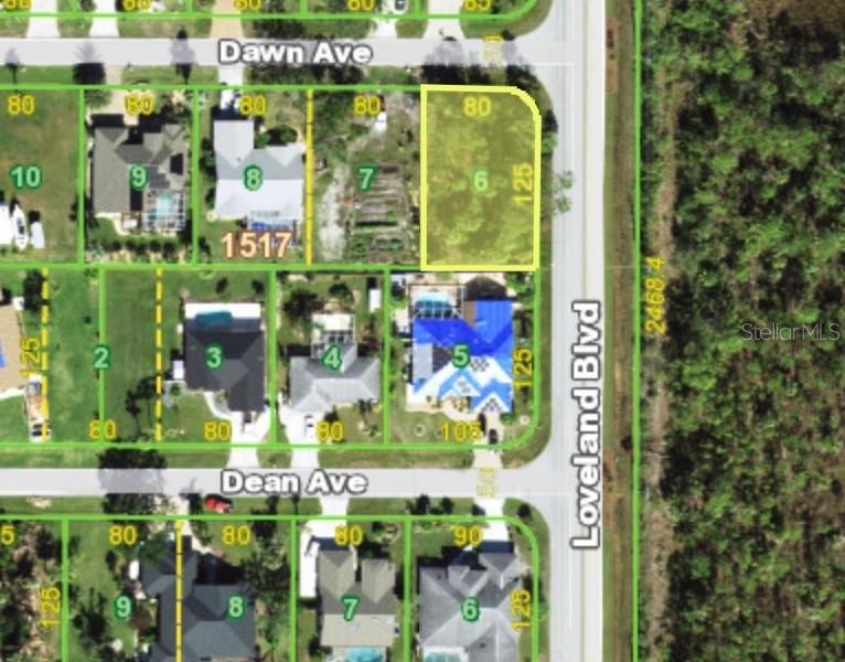 This is a map showing a vacant residential lot highlighted in yellow on a corner — 159 LOVELAND BOULEVARD, PORT CHARLOTTE, FL