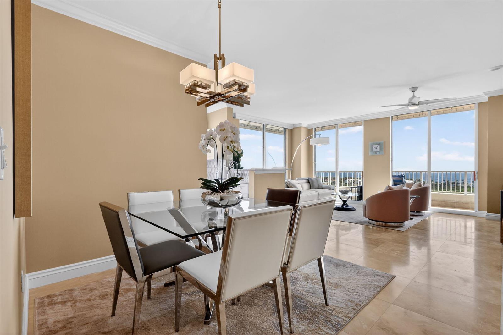A neutral-toned entryway features a mirrored wall piece, a decorative glass bowl, and white doors — 700 E Boynton Beach Boulevard # 2, Boynton Beach FL 33435, BOYNTON BEACH, FL
