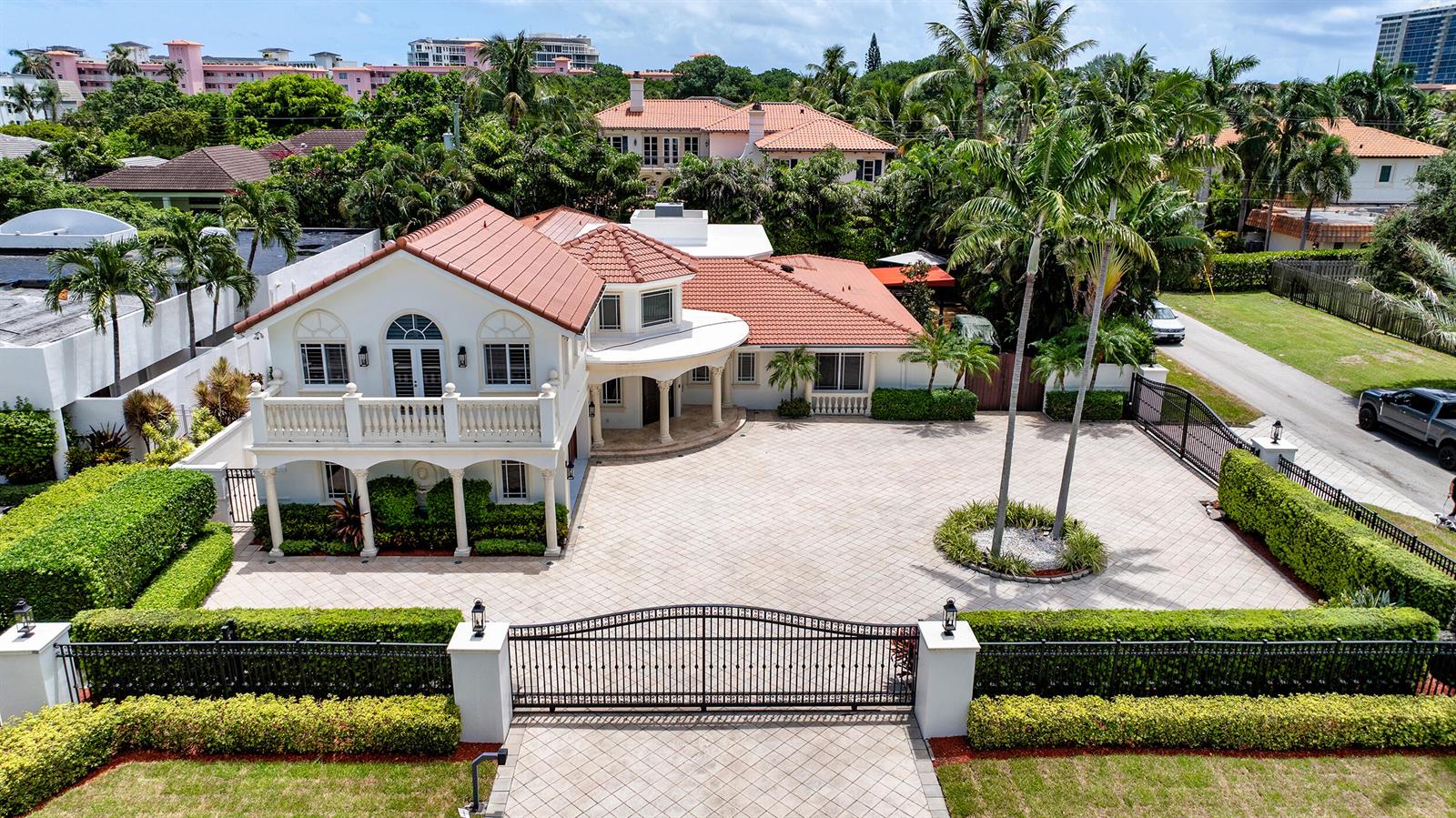 An aerial view of a two-story house with a tiled roof and a paved driveway — 1098 Spanish River Road, Boca Raton FL 33432, BOCA RATON, FL