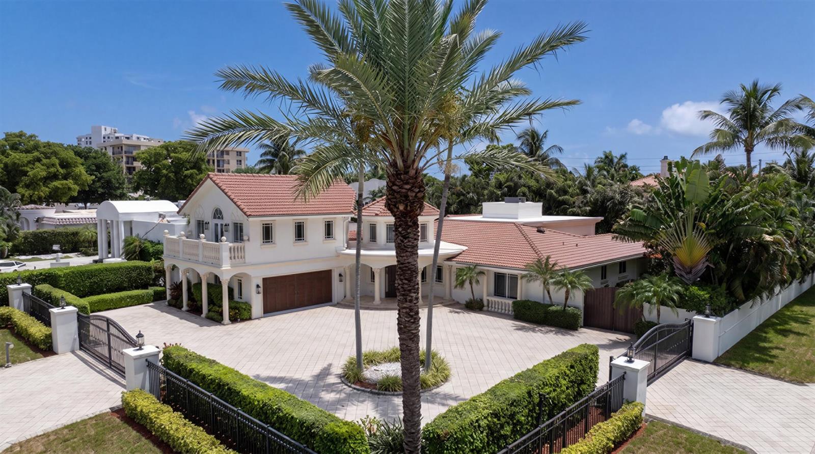 An aerial view of a two-story house with a tiled roof and a paved driveway — 1098 Spanish River Road, Boca Raton FL 33432, BOCA RATON, FL