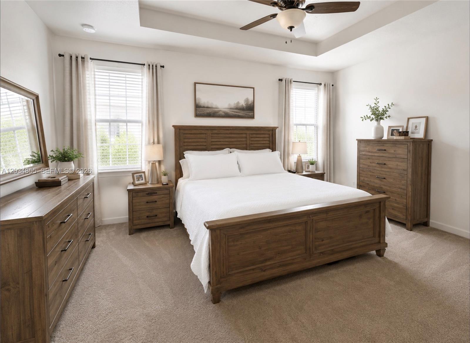 A bedroom features a wooden bed frame, matching dresser, nightstands, and a ceiling fan — 20866 NE 7th Pl, Miami FL 33179, MIAMI, FL