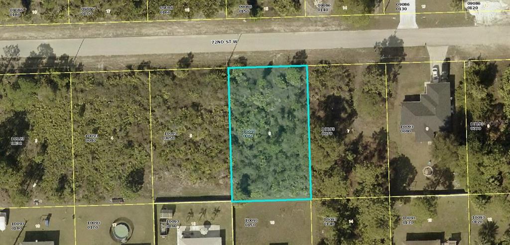 This is an aerial map showing a rectangular, undeveloped lot highlighted in blue — 3209 72ND ST W, LEHIGH ACRES, FL