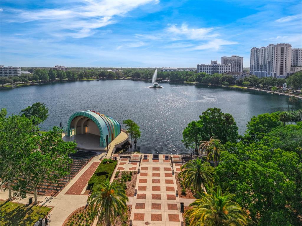 An aerial view of Lake Eola Park featuring the amphitheater, fountain, and surrounding city skyline — 151 E WASHINGTON STREET UNIT 404, ORLANDO, FL