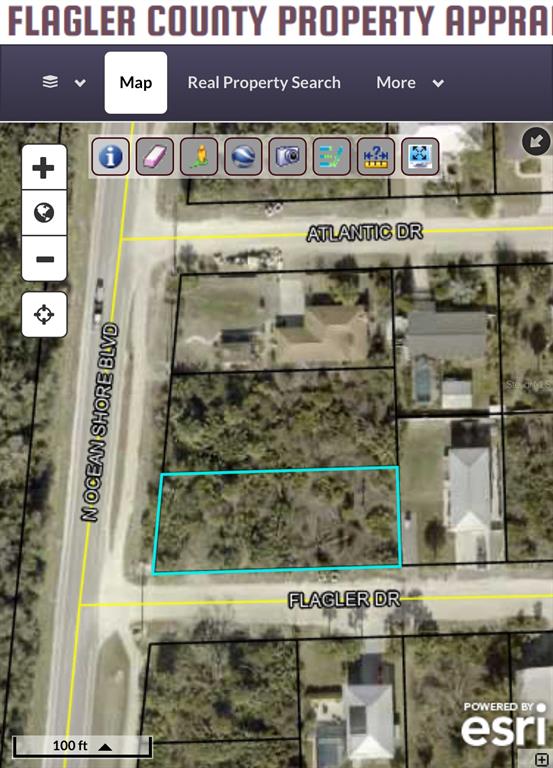 This is a map view showing a vacant, rectangular residential lot outlined in blue — 6235 N OCEAN SHORE BOULEVARD, PALM COAST, FL