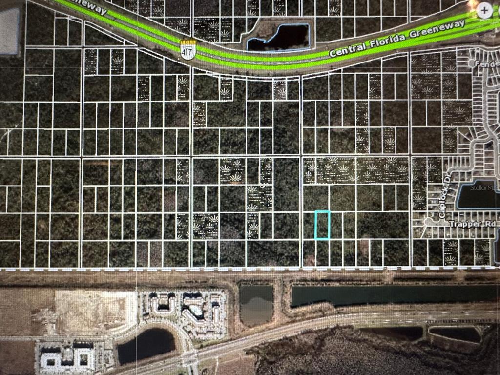 This is a satellite map view showing a highlighted vacant lot in a residential area — SR-535, ORLANDO, FL