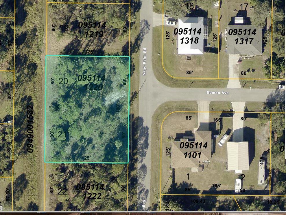 This is a property map showing a highlighted rectangular lot located on a wooded street — 20 SAGO PALM ROAD, NORTH PORT, FL