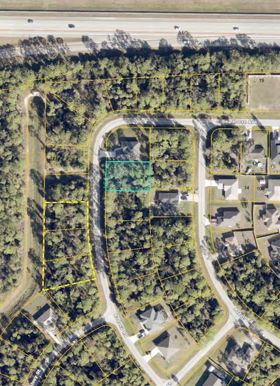 This is an aerial map showing a vacant residential lot highlighted in a subdivision — BADOSA ROAD, NORTH PORT, FL