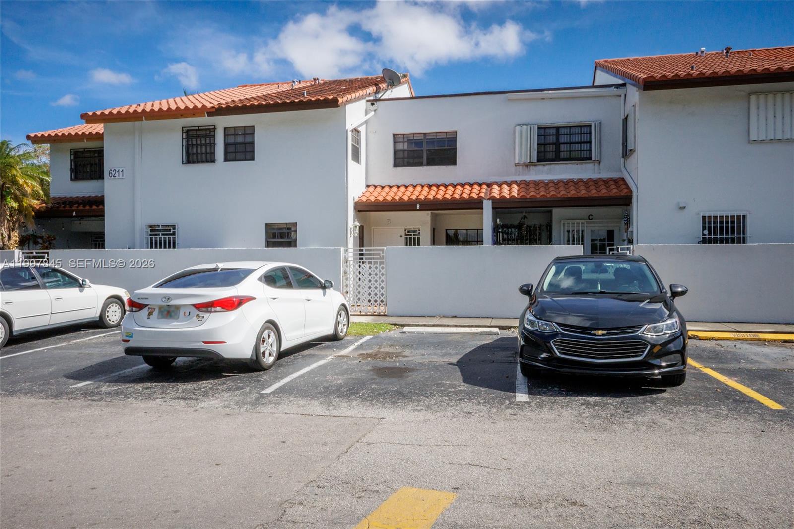 A two-story residential building with white stucco walls and a red tile roof — 6211 SW 138th Ct # B, Miami FL 33183, MIAMI, FL