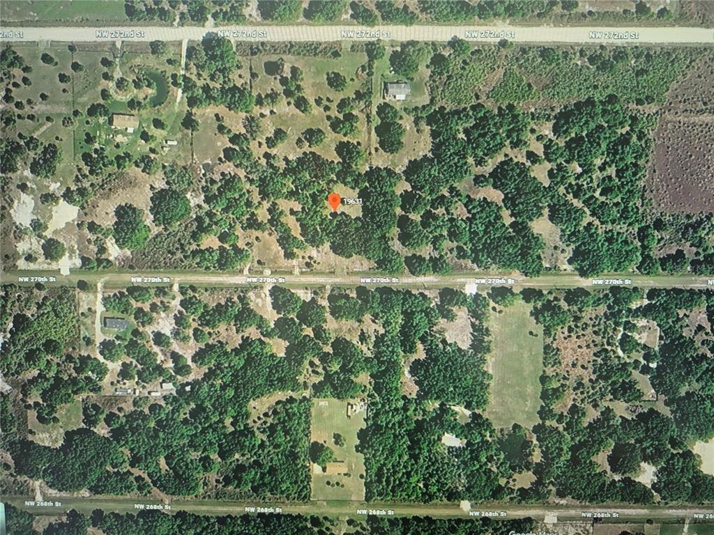 This is an aerial map view of a wooded residential lot with surrounding streets — 19631 NW 270TH STREET, OKEECHOBEE, FL