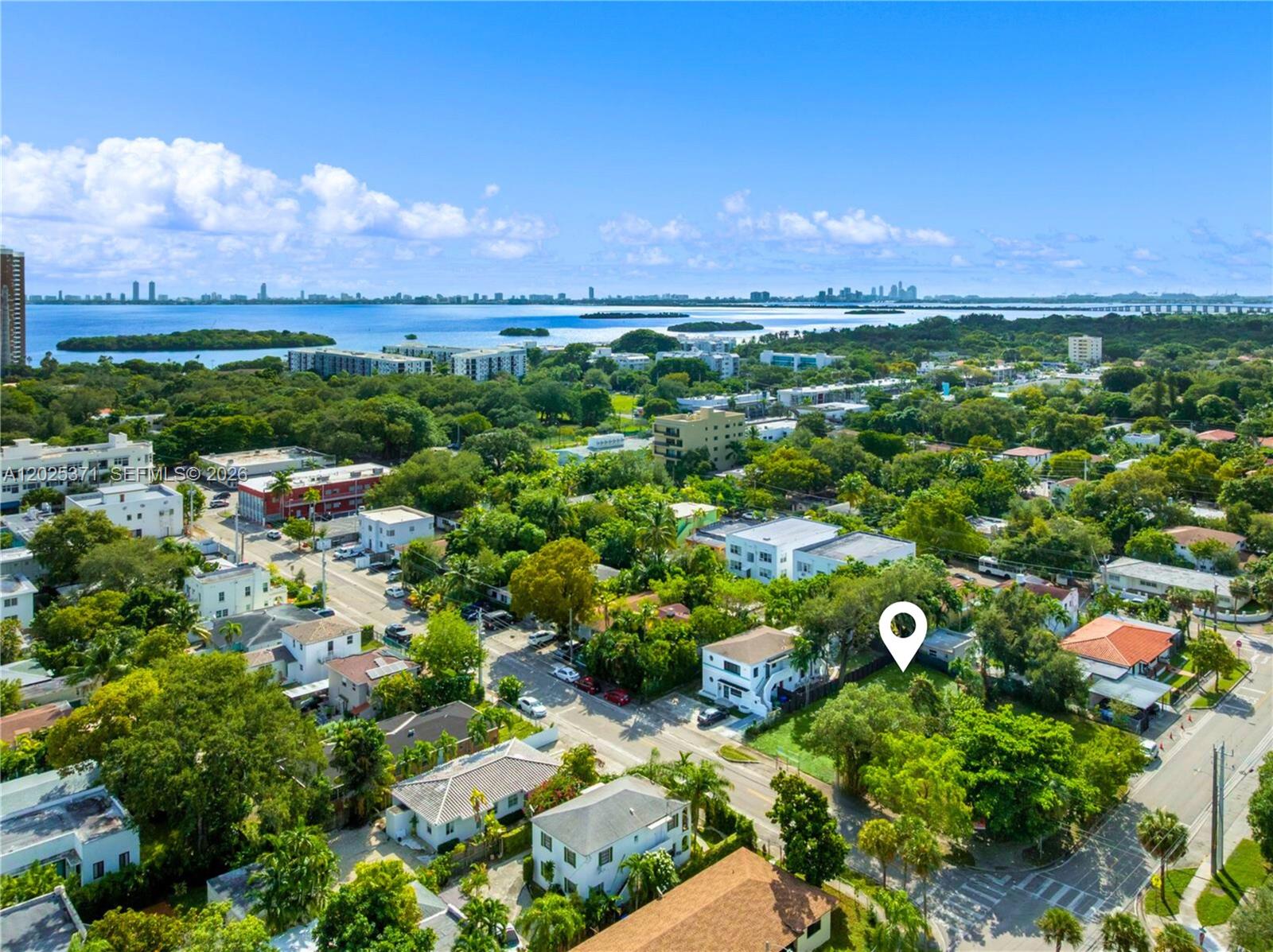 An aerial view shows a residential neighborhood with a marked lot near the water — 508 NE 67th St, Miami FL 33138, MIAMI, FL