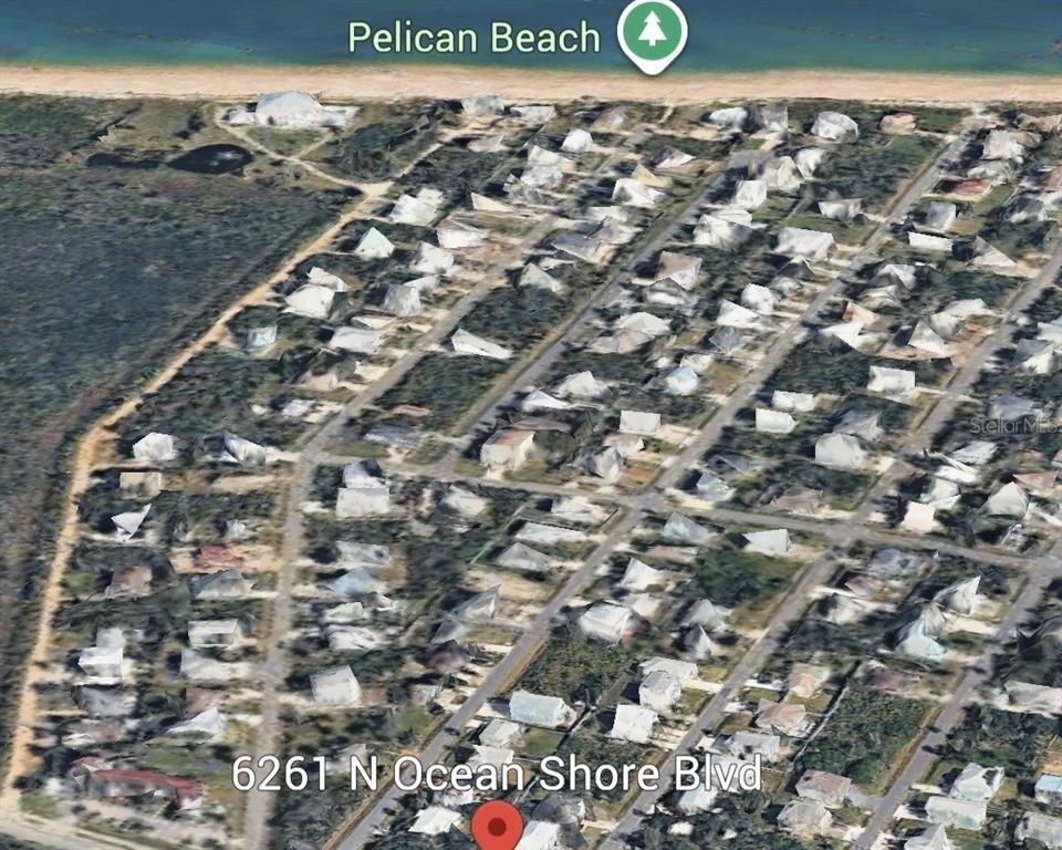 An aerial map view shows a residential neighborhood located along a sandy beach — 6261 N OCEAN SHORE BOULEVARD, PALM COAST, FL