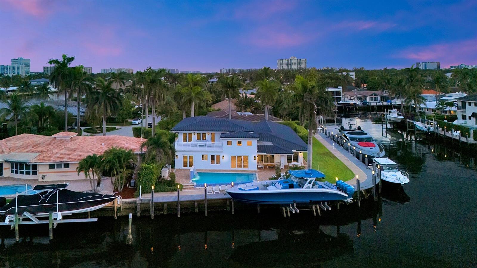 An aerial view of a waterfront house with a swimming pool and multiple docked boats — 2593 SE 9th Street, Pompano Beach FL 33062, POMPANO BEACH, FL