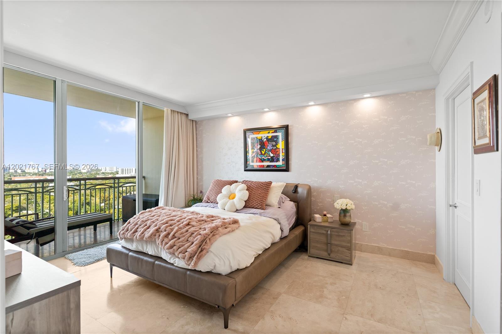 A living room features a beige sectional sofa, patterned wallpaper, and a balcony with views — 3350 SW 27th Ave # 1706, Coconut Grove FL 33133, COCONUT GROVE, FL