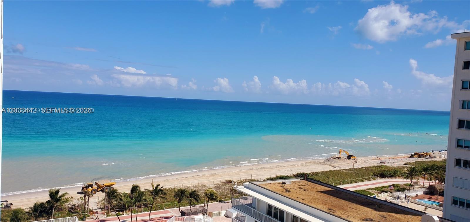 An elevated view shows a beach with construction equipment and a nearby high-rise building — 5401 Collins Ave # 231, Miami Beach FL 33140, MIAMI BEACH, FL