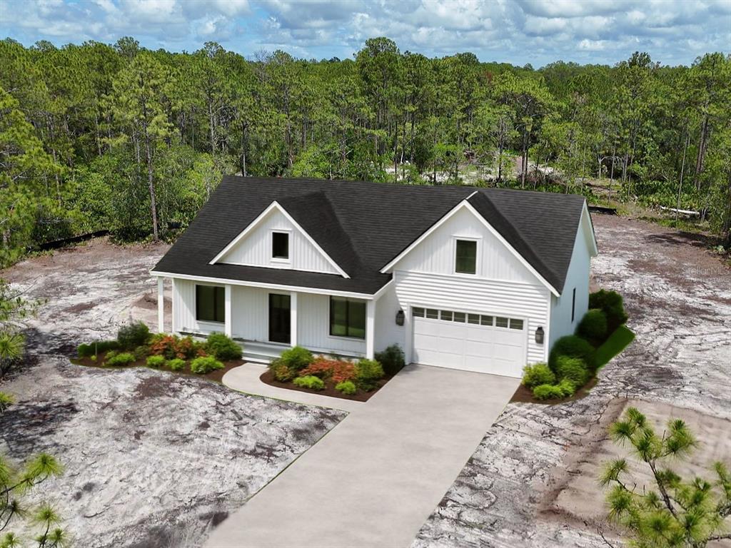 This is a rendering of a white farmhouse-style house with a garage and wooded surroundings — 4678 GUM ROAD, NEW SMYRNA BEACH, FL