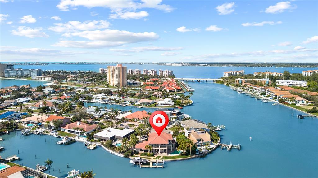 A two-story stucco house with a tile roof, a three-car garage, and a paved driveway — 4914 59TH AVENUE S, ST PETERSBURG, FL