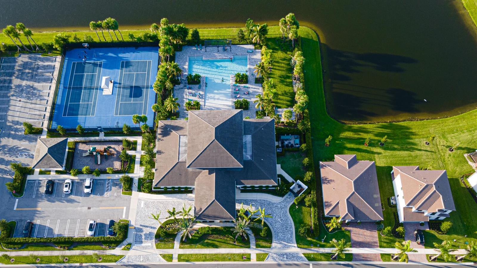 An aerial view shows a community clubhouse with a pool, tennis courts, and nearby houses — 3509 Bauer Road, Royal Palm Beach FL 33411, ROYAL PALM BEACH, FL