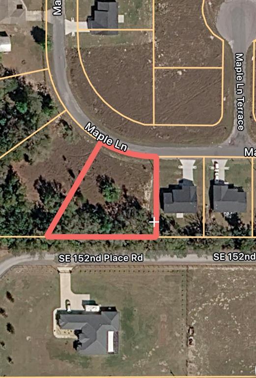 This is an aerial map showing a vacant residential lot outlined in red — MAPLE LANE UNIT 14, OCKLAWAHA, FL