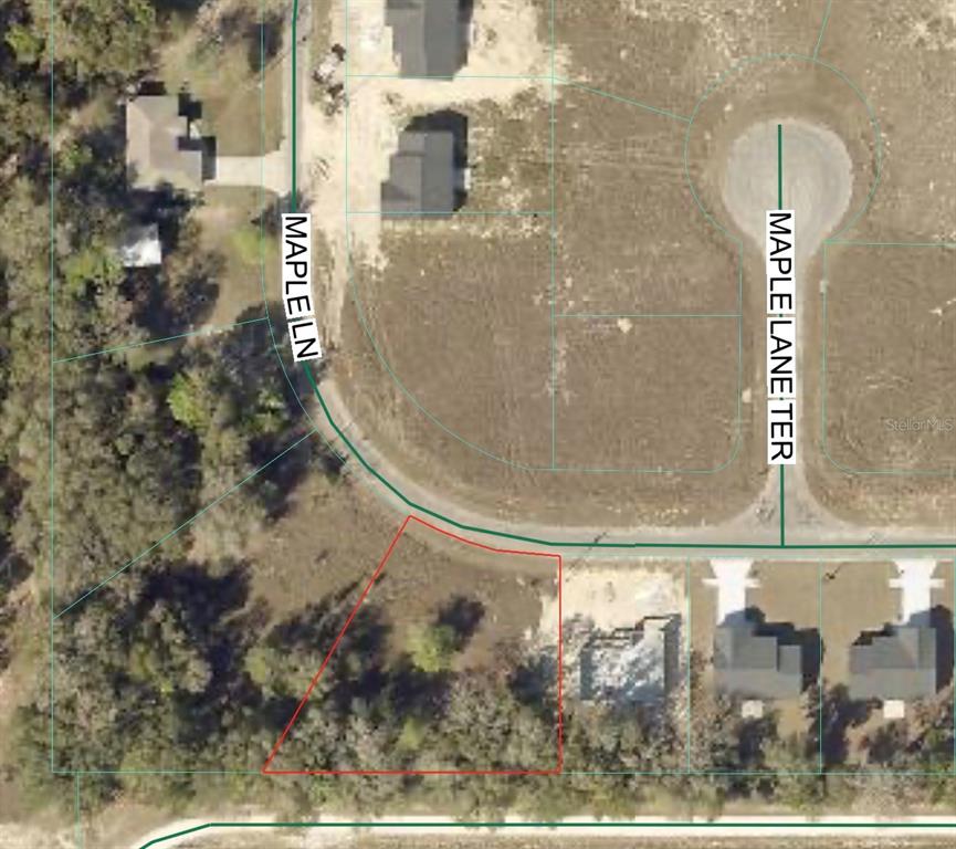 This is an aerial map showing a vacant residential lot outlined in red — MAPLE LANE UNIT 14, OCKLAWAHA, FL