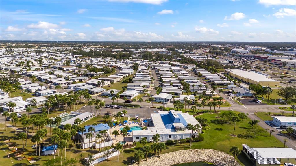 An aerial view of a mobile home community featuring a clubhouse and swimming pool — 620 CERVINA DRIVE S, VENICE, FL