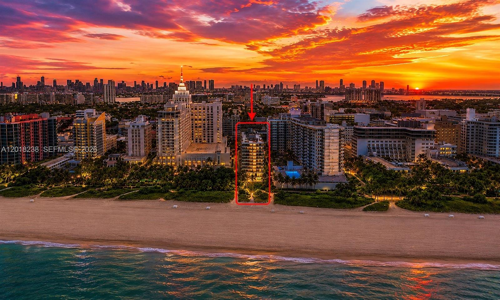 An aerial view shows a beachfront condominium building highlighted by a red box at sunset — 1621 Collins Ave # 310, Miami Beach FL 33139, MIAMI BEACH, FL