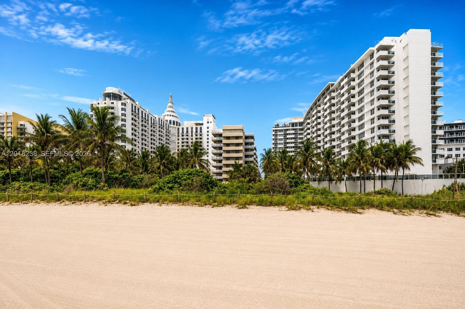 A sandy beach sits in front of several large white high-rise residential buildings — 1621 Collins Ave # 310, Miami Beach FL 33139, MIAMI BEACH, FL