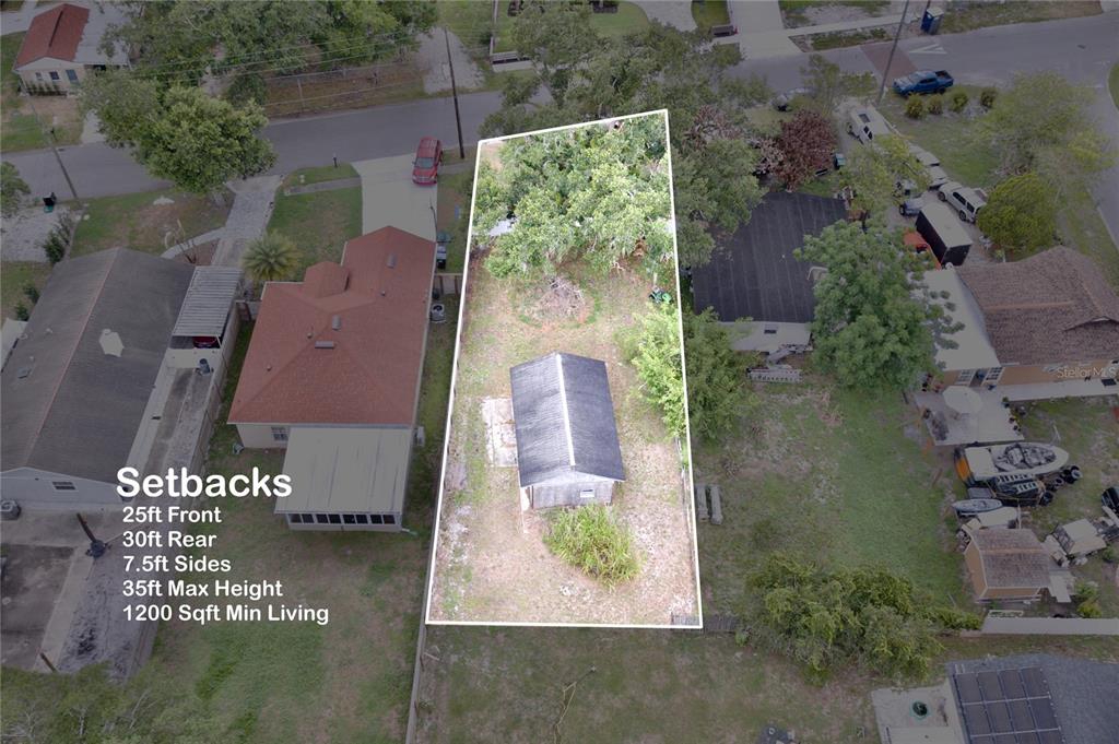 An aerial view shows a vacant residential lot with a small shed and setback requirements — 1333 SUSANNAH BOULEVARD, ORLANDO, FL