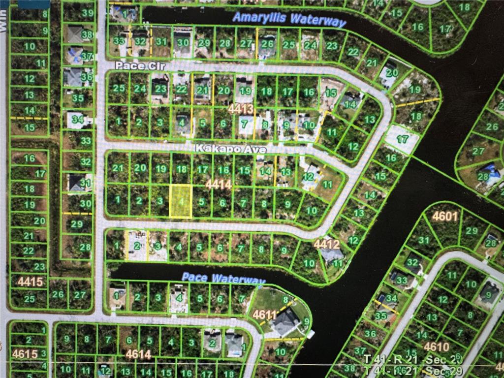 This is a satellite map showing residential lots and waterways in a suburban neighborhood — 13379 PACE CIRCLE, PORT CHARLOTTE, FL