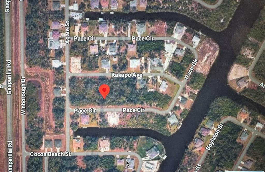 This is a satellite map view of a vacant residential lot surrounded by neighborhood streets — 13379 PACE CIRCLE, PORT CHARLOTTE, FL