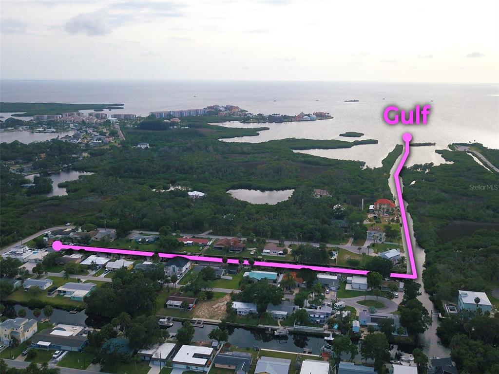 This is a floor plan of a house superimposed over an image of its exterior — 8542 BETTY STREET, PORT RICHEY, FL