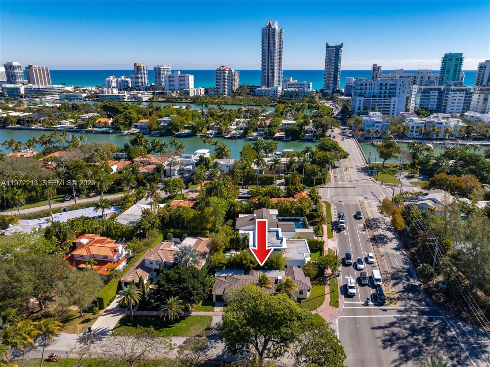 An aerial view shows a residential property with a red arrow pointing to the house — 6311 La Gorce Dr, Miami Beach FL 33141, MIAMI BEACH, FL