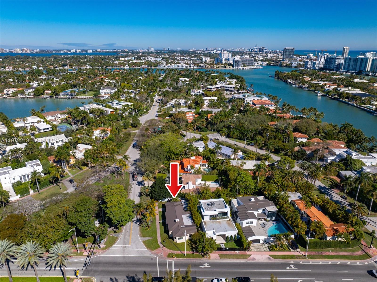 An aerial view shows a residential neighborhood with a red arrow pointing to a house — 6311 La Gorce Dr, Miami Beach FL 33141, MIAMI BEACH, FL