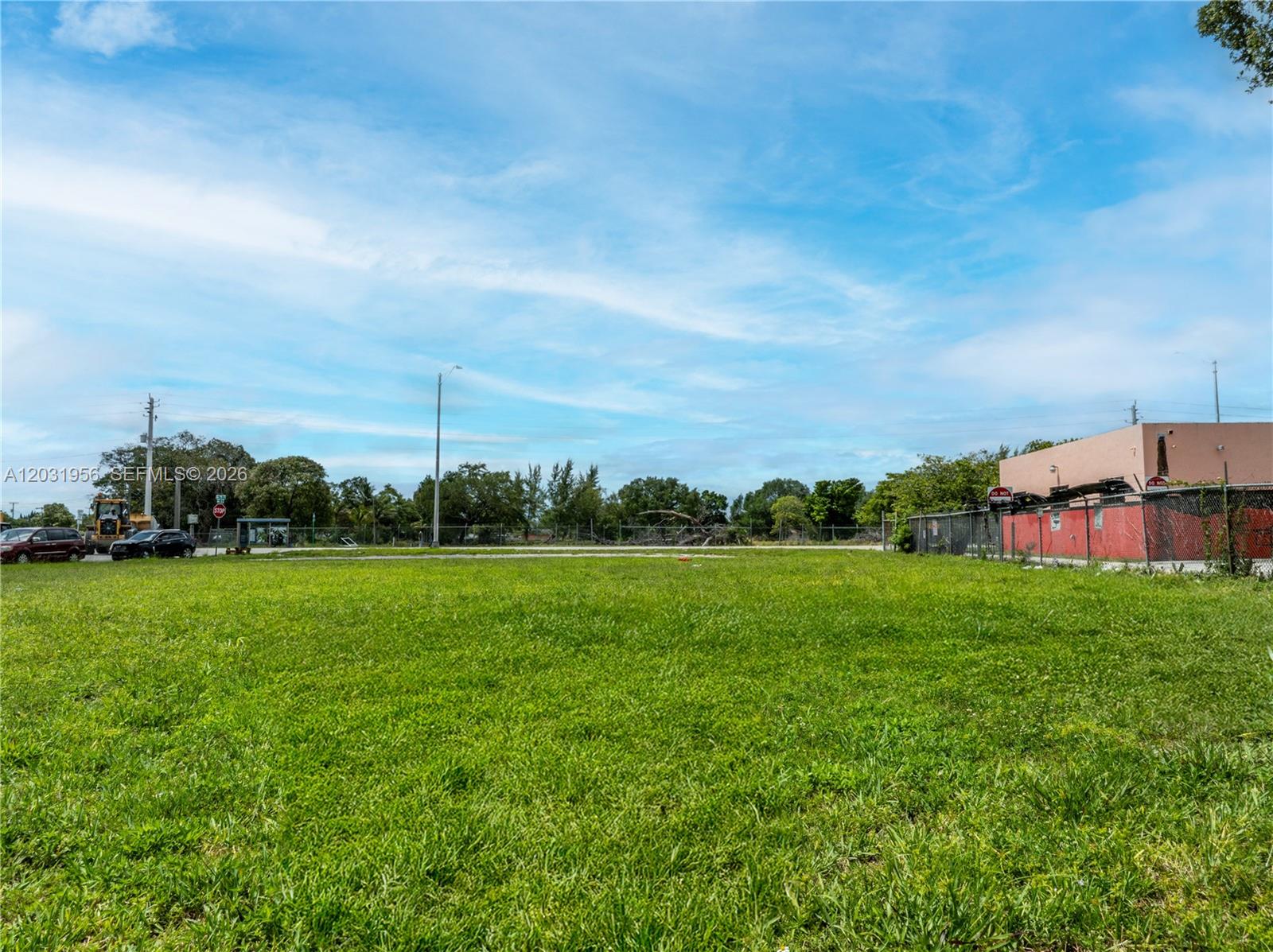 A large, flat, grassy vacant lot sits under a bright blue sky — 7920 NW 11th Ave, Miami FL 33150, MIAMI, FL