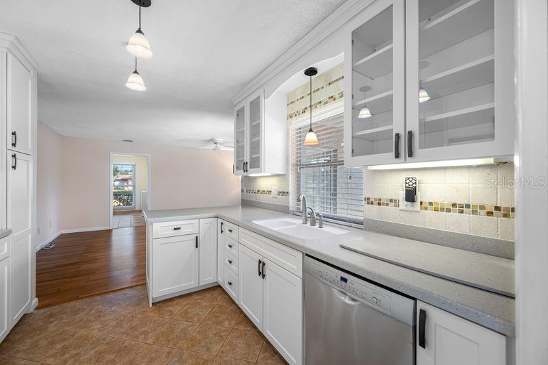 A kitchen with white cabinets, stainless steel appliances, and a window over the sink — 3241 BUCKHORN DR, CLEARWATER, FL