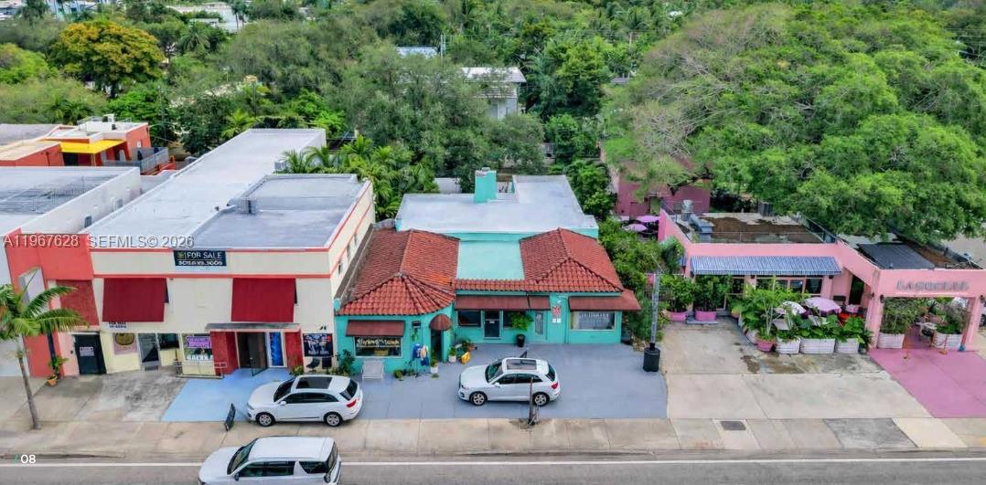 An aerial view shows three adjacent commercial buildings with a parking area in front — 7613 Biscayne Blvd, Miami FL 33138, MIAMI, FL