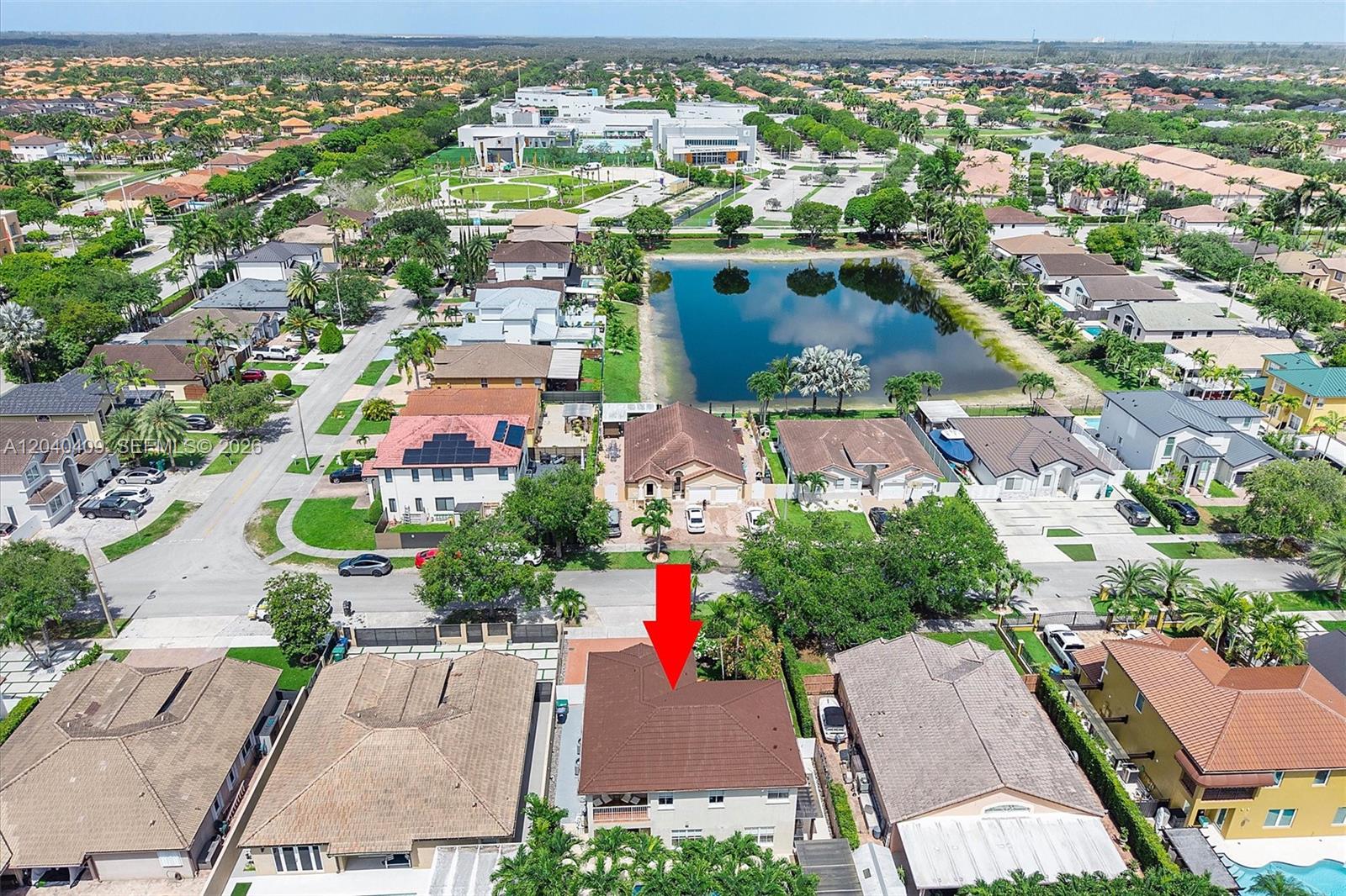 An aerial view shows a residential neighborhood with a red arrow pointing to a house — 2517 SW 148th Ct, Miami FL 33185, MIAMI, FL